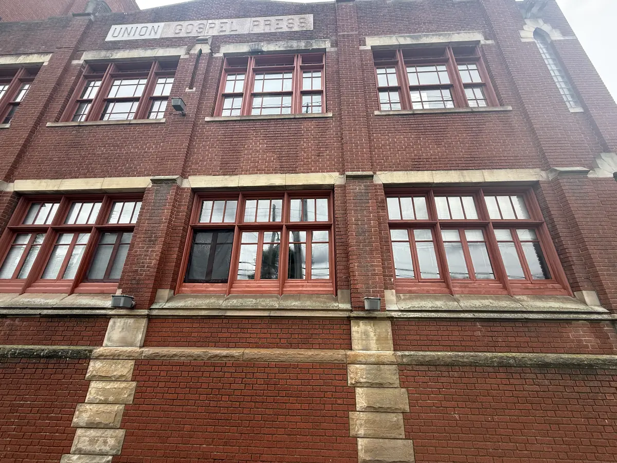 Commercial masonry facade photographed before cleaning